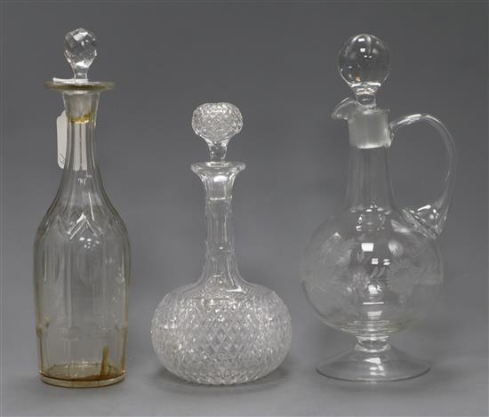 Two glass decanters and a claret jug